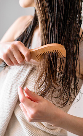 wooden comb on wet hair